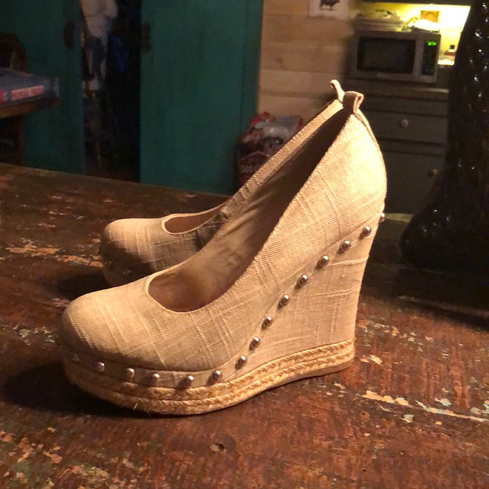 Cream colored linen wedge with gold studs by Aldo